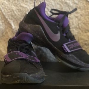 Black and purple Nike basketball shoes